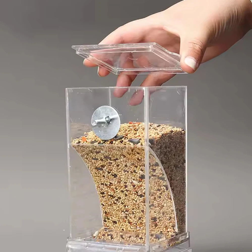 Caja de alimentación para aves que reduce derrames de semillas